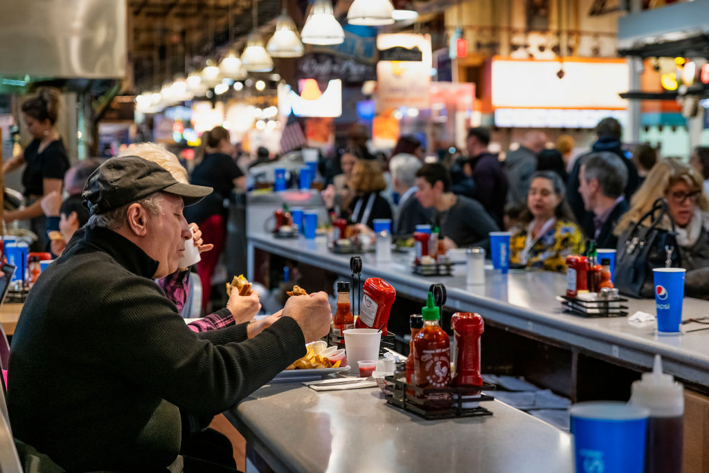 Diners eating lunch at the Reading Terminal Market in...