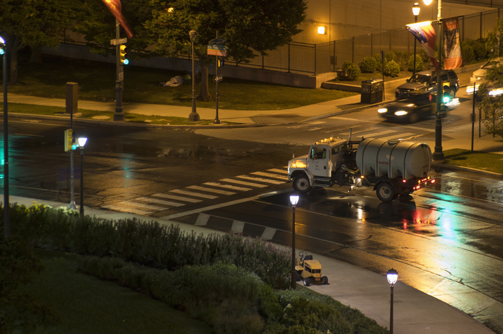 A street cleaning vehicle in action.