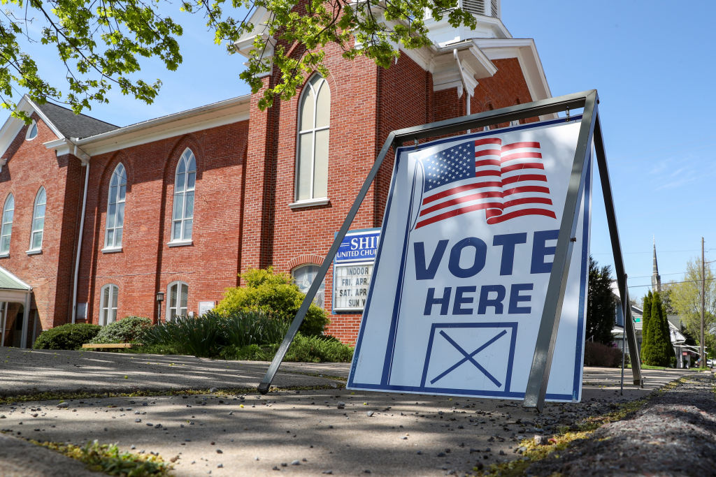 A "vote here" sign is seen outside of the Shiloh United...
