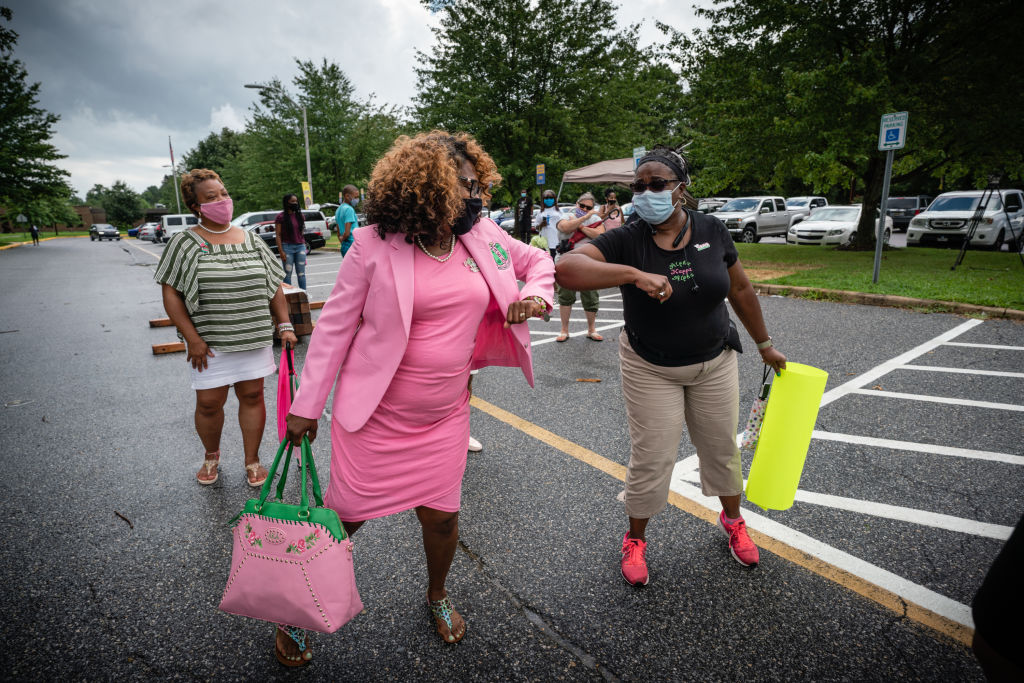 Supporters gather for Joe Biden and Kamala Harris as they appear at a news conference for the first time as the 2020 Democratic presidential ticket.