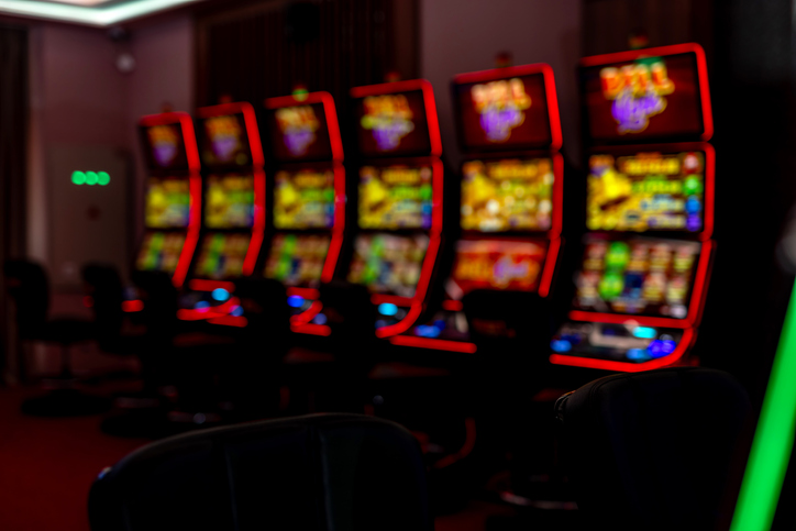 Brightly Illuminated Slot Machines in a Modern Casino Interior