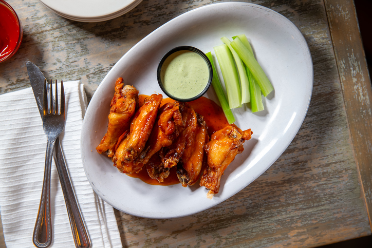 Top down angle of Buffalo chicken wings with celery