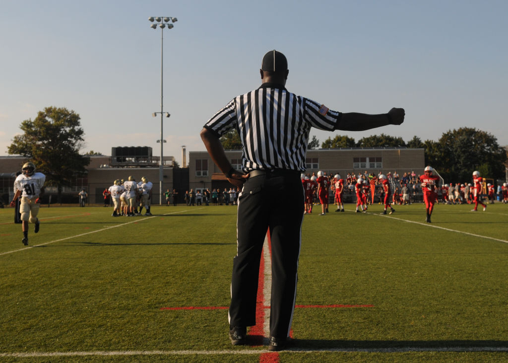 William Thomas on the side of the field before the start of a play.At the Gov. Mifflin Athletic Complex Wednesday afternoon where former NFL football player William Thomas was officiating for a Junior High football game between Wilson and Gov. M